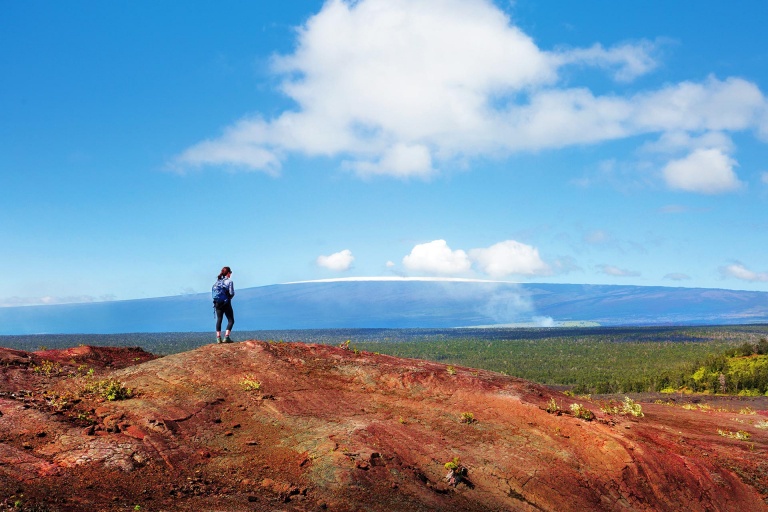 hiker in hawaii trekking across the volcano national park landscape big island kailani tours hawaii